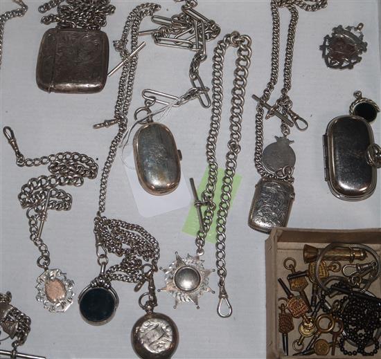 A group of silver watch chains, vestas, sovereign holders, fobs and keys etc
